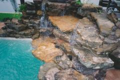 rock waterfall added to swimming pool