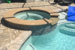 new spa addition, spill-over, paver deck, pebble interior surface and tile