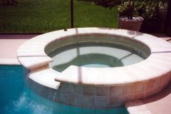 Added spa with new coping, tile, pool interior, bench, spill-over