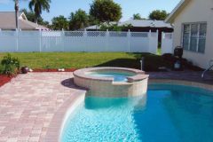 Raised spa with spill over, brick pavers, pool remodel and fencing