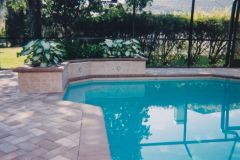 raised decorative planter wall added including brick paver deck & pool renovation