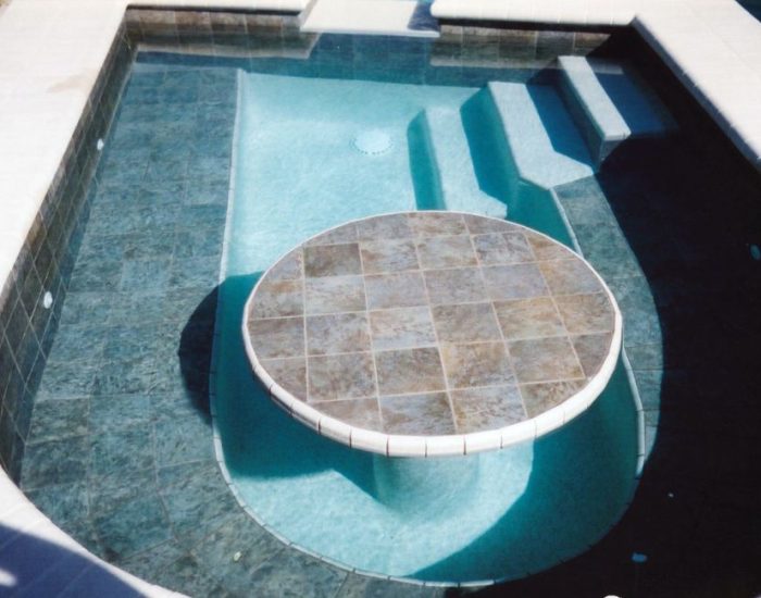custom build spa with tiled seat and table, steps